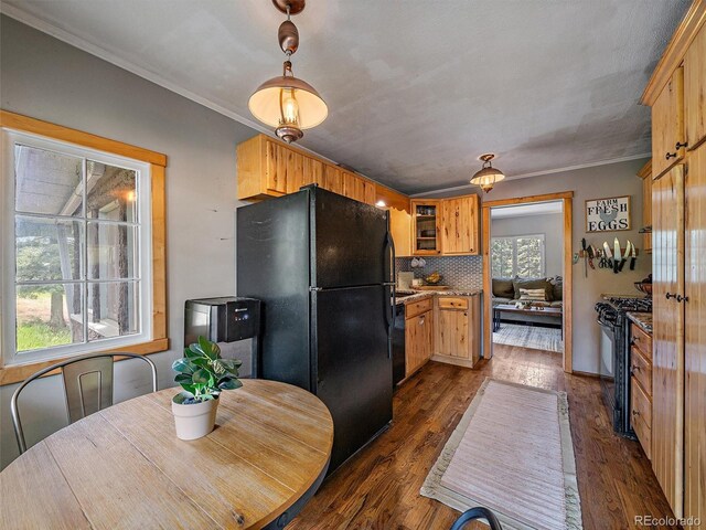 27385 Spruce Ln, Evergreen, CO 80439 - kitchen with black appliances, tasteful backsplash, ornamental molding, dark wood finished floors, and glass insert cabinets