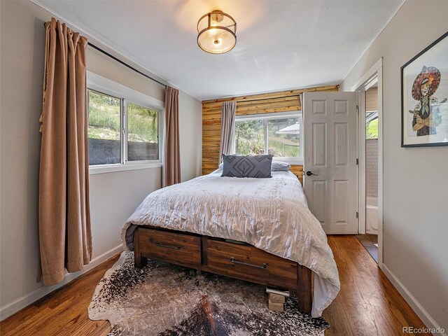 27385 Spruce Ln, Evergreen, CO 80439 - bedroom with hardwood / wood-style floors and multiple windows