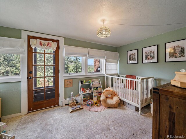 27385 Spruce Ln, Evergreen, CO 80439 - carpeted bedroom featuring a textured ceiling and baseboards