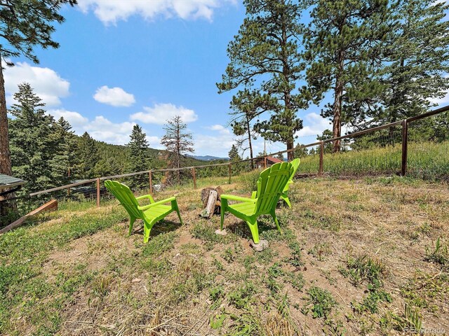 27385 Spruce Ln, Evergreen, CO 80439 - view of yard with a mountain view