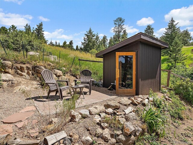 27385 Spruce Ln, Evergreen, CO 80439 - view of patio with a storage unit