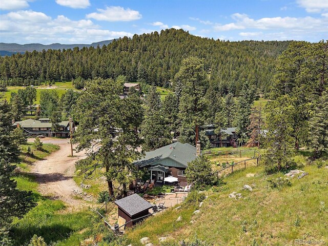 27385 Spruce Ln, Evergreen, CO 80439 - view from above of property featuring a heavily wooded area and a mountain backdrop