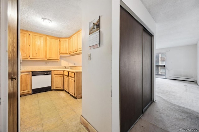 kitchen featuring a textured ceiling, dishwasher, light brown cabinetry, light colored carpet, and a baseboard radiator