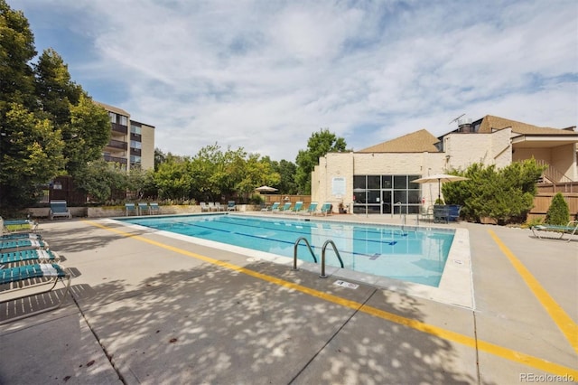 view of swimming pool featuring a patio