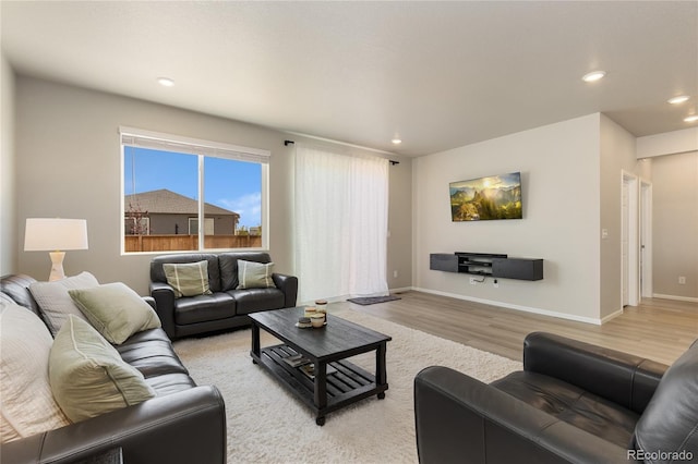 6150 Sugarloaf St, Brighton, CO 80601 - living room with light wood-type flooring and recessed lighting