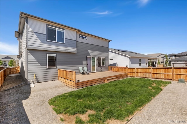 6150 Sugarloaf St, Brighton, CO 80601 - back of house with a fenced backyard and a wooden deck