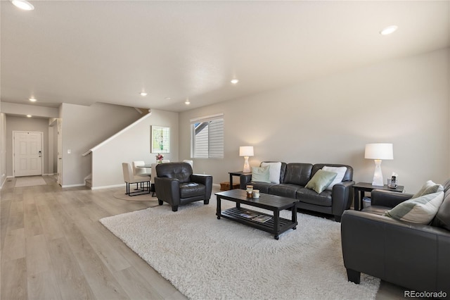 6150 Sugarloaf St, Brighton, CO 80601 - living area with stairway, light wood-style flooring, and recessed lighting