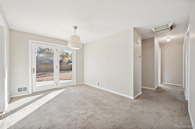 unfurnished room featuring light carpet