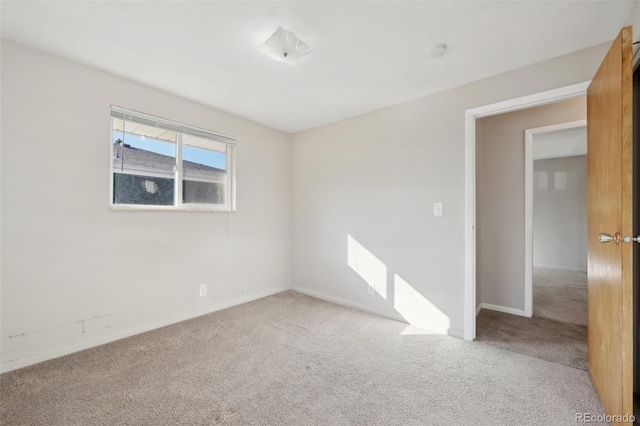 unfurnished room featuring carpet