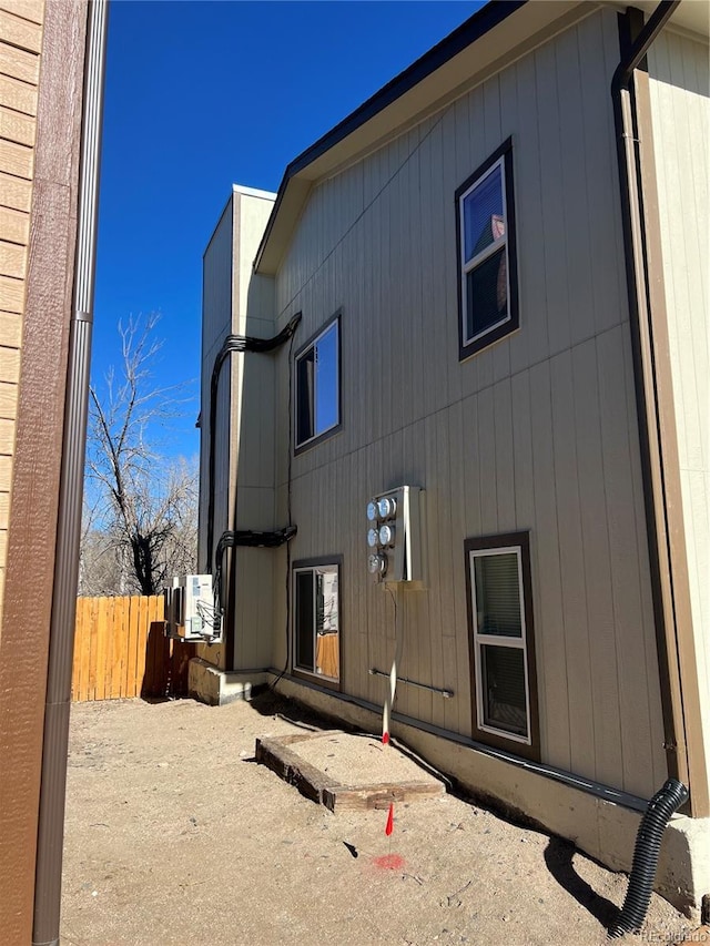 back of property featuring ac unit