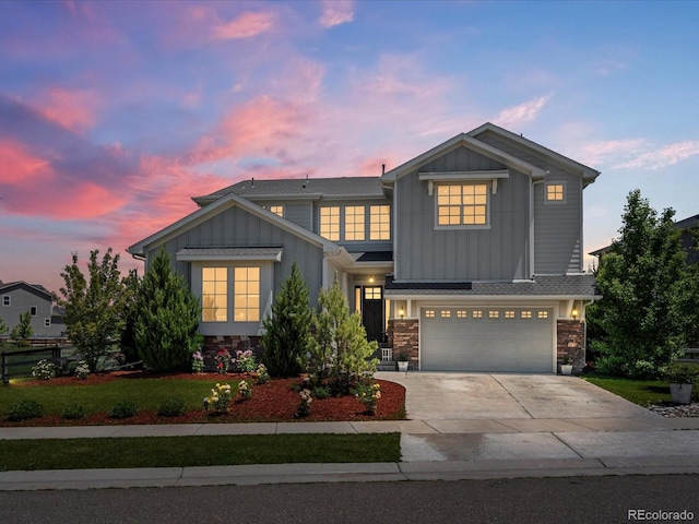 1291 Fountain Ln, Erie, CO 80516 - view of front facade featuring board and batten siding, stone siding, concrete driveway, and a garage