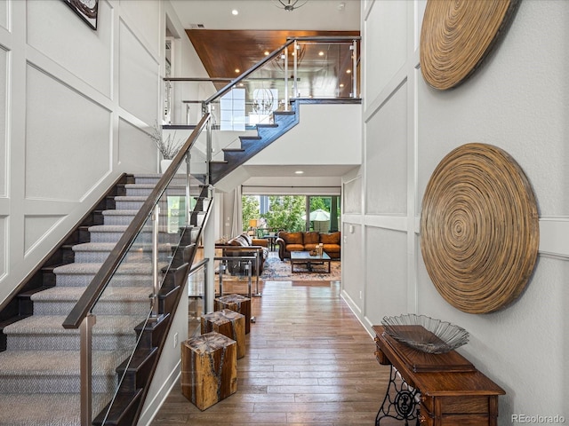 1291 Fountain Ln, Erie, CO 80516 - foyer with stairs, hardwood / wood-style floors, and a towering ceiling