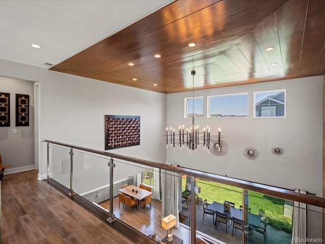 1291 Fountain Ln, Erie, CO 80516 - corridor featuring a chandelier, wood finished floors, recessed lighting, and wood ceiling