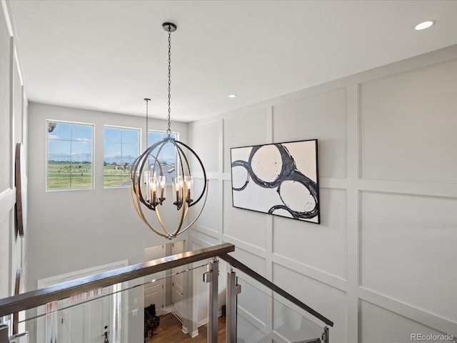 1291 Fountain Ln, Erie, CO 80516 - detailed view of a decorative wall, a chandelier, and recessed lighting