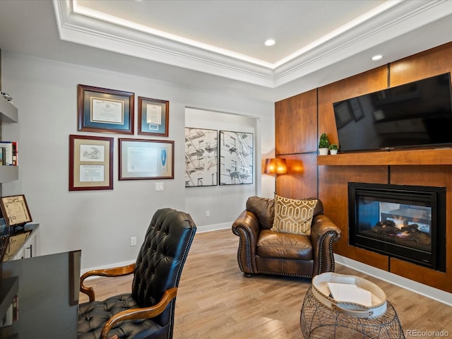 1291 Fountain Ln, Erie, CO 80516 - office space with a tray ceiling, light wood-style flooring, crown molding, a multi sided fireplace, and recessed lighting