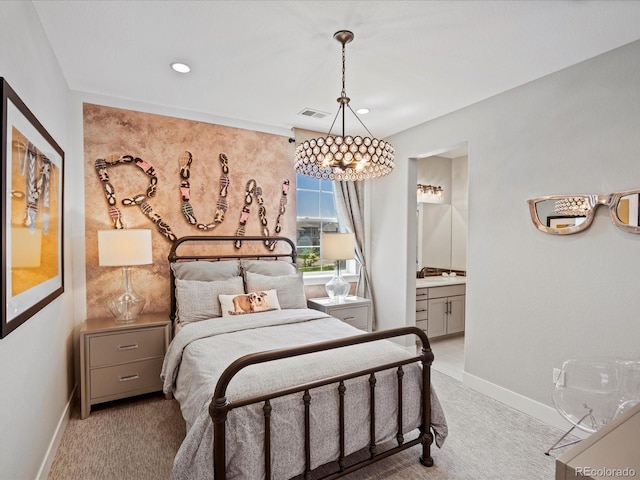 1291 Fountain Ln, Erie, CO 80516 - carpeted bedroom with a chandelier, recessed lighting, and ensuite bathroom
