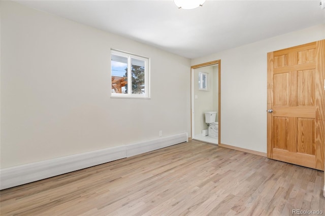 unfurnished bedroom with light wood-type flooring