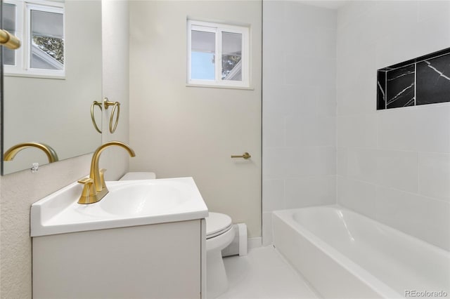 full bathroom featuring vanity, toilet, and tiled shower / bath combo