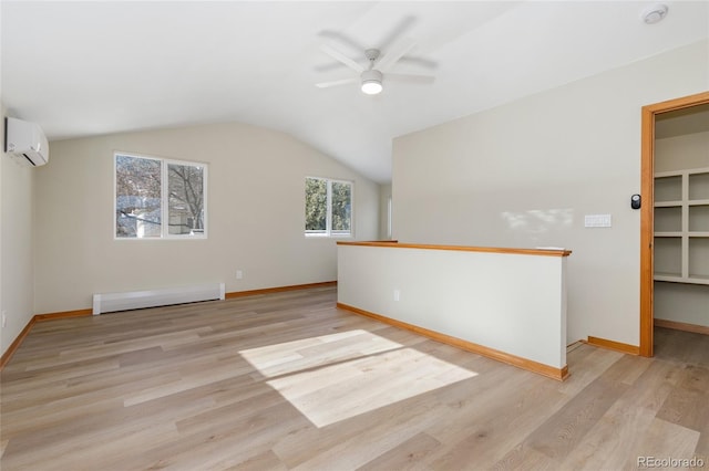 bonus room featuring a wall mounted air conditioner, vaulted ceiling, light hardwood / wood-style flooring, a baseboard radiator, and ceiling fan