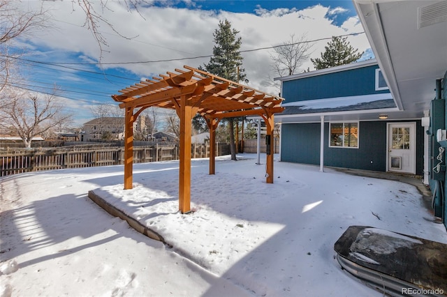 yard covered in snow featuring a fenced backyard and a pergola