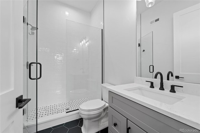 8077 Raphael Ln, Littleton, CO 80125 - bathroom featuring a shower stall, vanity, and tile patterned floors