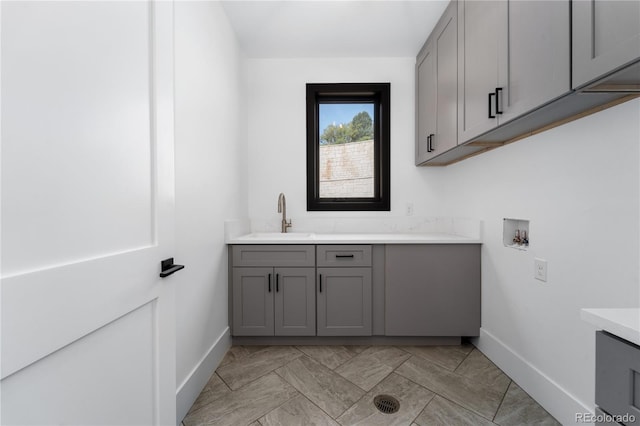 8077 Raphael Ln, Littleton, CO 80125 - washroom with cabinet space and hookup for a washing machine