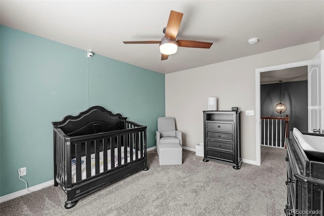 bedroom with light carpet, a ceiling fan, and baseboards