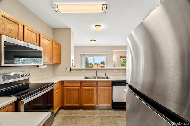 228 Quari St, Aurora, CO 80011 - kitchen featuring appliances with stainless steel finishes and light countertops