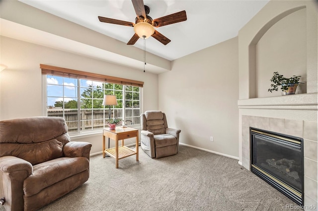 228 Quari St, Aurora, CO 80011 - sitting room featuring ceiling fan, carpet, and a tiled fireplace