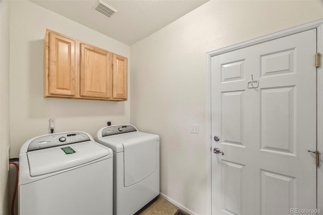 228 Quari St, Aurora, CO 80011 - laundry room featuring washer and dryer and cabinet space