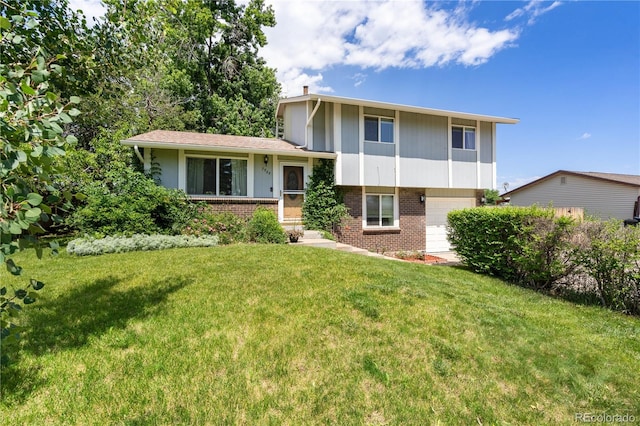 7565 Newland St, Arvada, CO 80003 - tri-level home featuring brick siding, an attached garage, and a front lawn