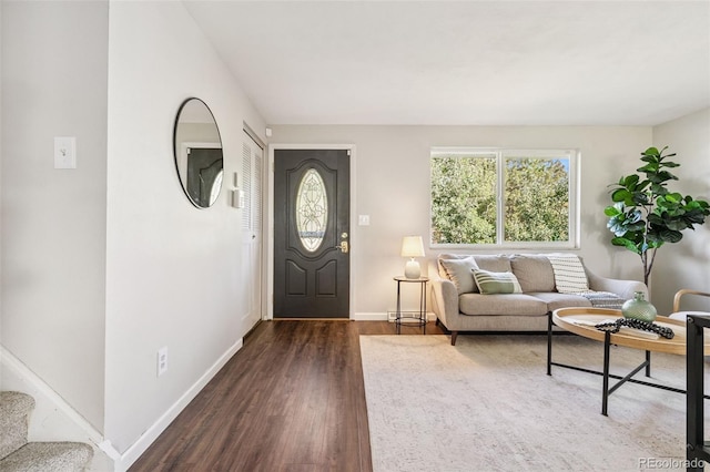 7565 Newland St, Arvada, CO 80003 - living area with dark wood-style floors and stairs