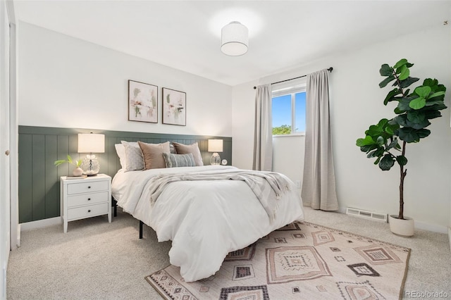 7565 Newland St, Arvada, CO 80003 - bedroom featuring carpet floors and wainscoting