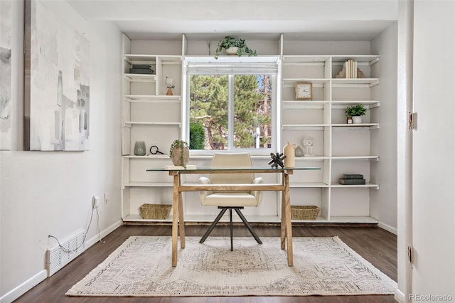 7565 Newland St, Arvada, CO 80003 - office featuring dark wood-style flooring and baseboards