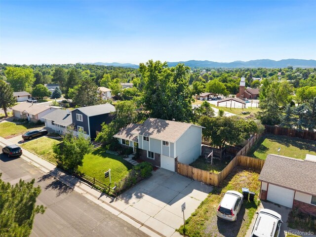 7565 Newland St, Arvada, CO 80003 - aerial view of residential area with mountains
