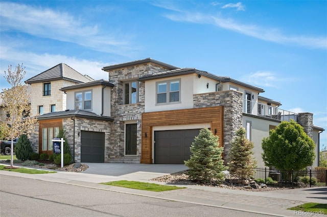 2136 S Juniper St, Lakewood, CO 80228 - contemporary home featuring stone siding, stucco siding, fence, and an attached garage