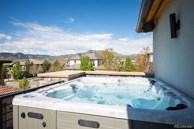 2136 S Juniper St, Lakewood, CO 80228 - view of swimming pool with a hot tub and a mountain view