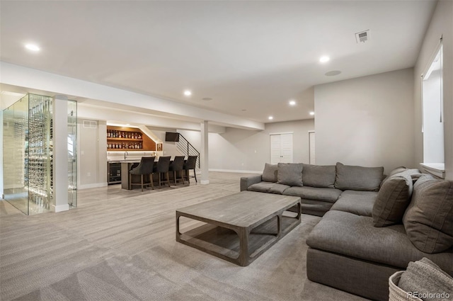 2136 S Juniper St, Lakewood, CO 80228 - living room featuring wet bar, recessed lighting, baseboards, wine cooler, and light colored carpet
