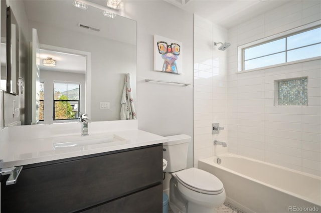 2136 S Juniper St, Lakewood, CO 80228 - full bathroom with plenty of natural light, toilet, vanity, and washtub / shower combination