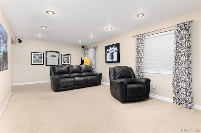 living room featuring carpet floors, recessed lighting, and baseboards