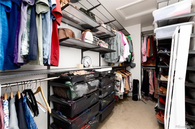 walk in closet featuring attic access and visible vents