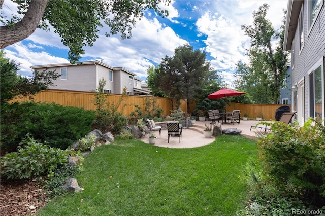 view of yard featuring a patio and fence