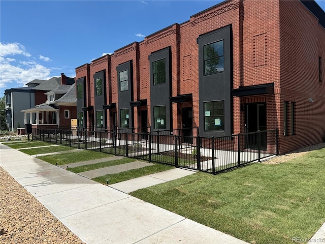 115 W 2nd Ave Unit 104, Denver, CO 80223 - view of building exterior with a residential view