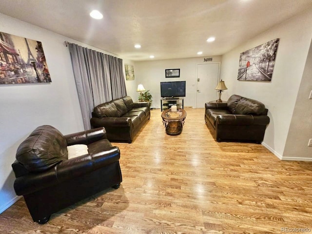 living room with light hardwood / wood-style floors