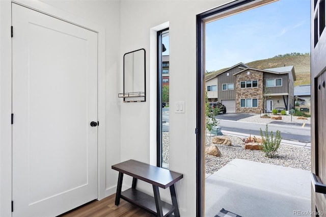 doorway to outside with wood finished floors