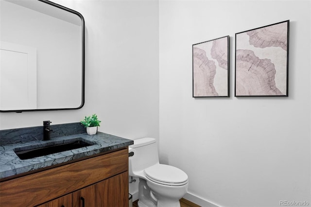 bathroom with vanity and toilet