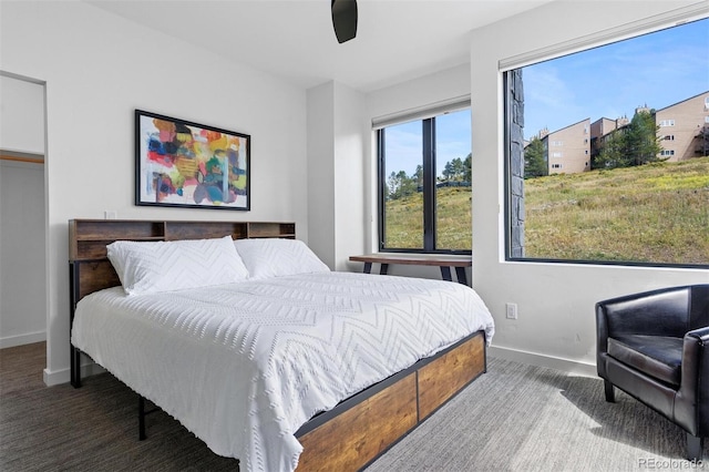 carpeted bedroom with ceiling fan