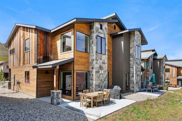 rear view of property featuring a patio