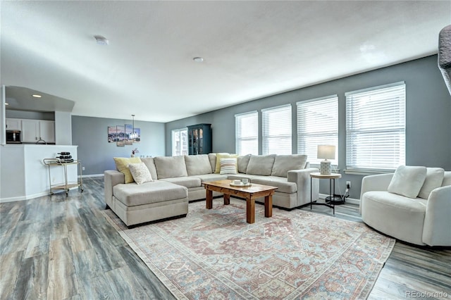 living room featuring wood finished floors and baseboards