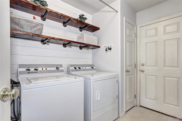 clothes washing area featuring laundry area and independent washer and dryer